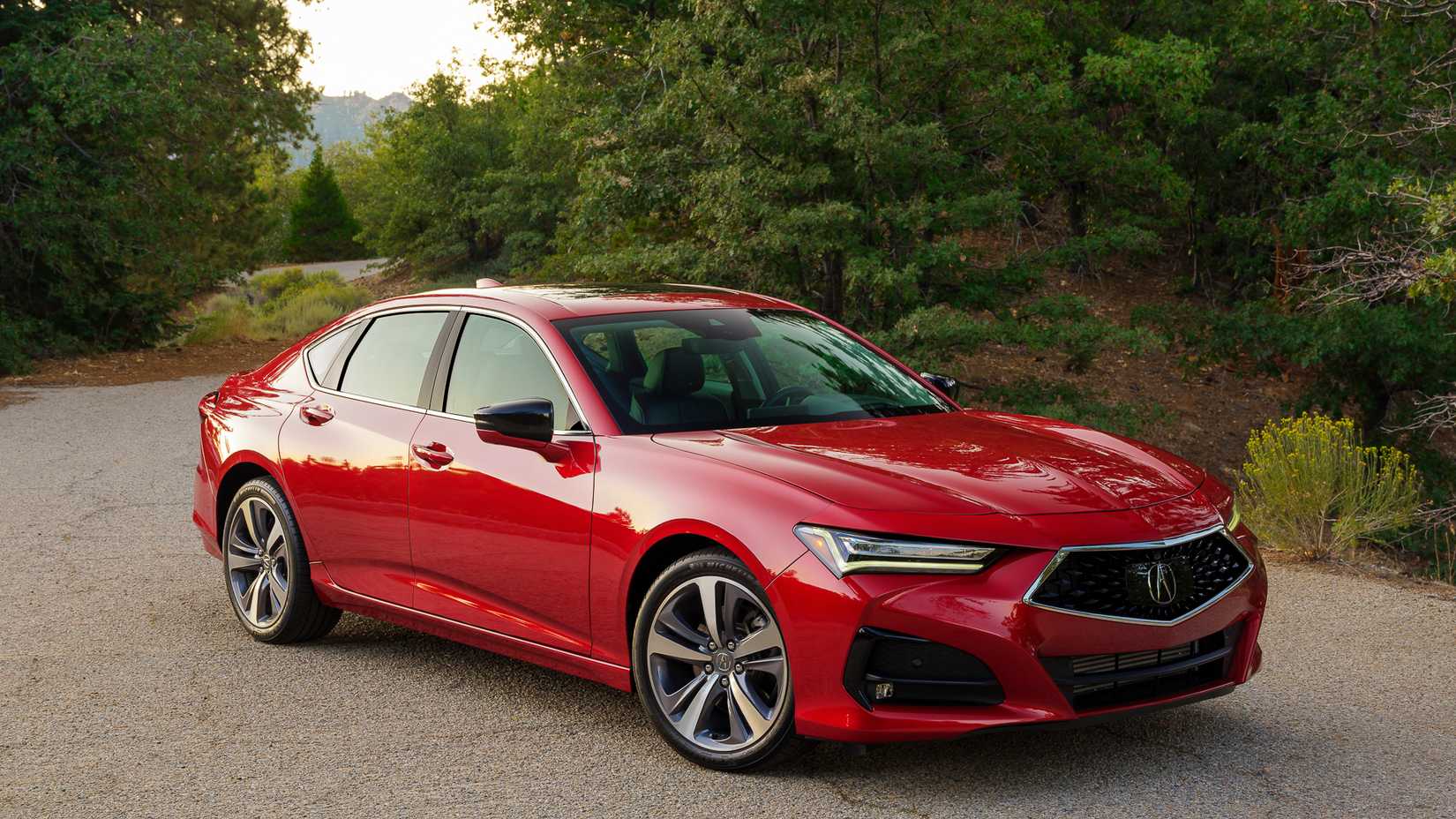 2021-2024 Red Acura TLX parked in the countryside