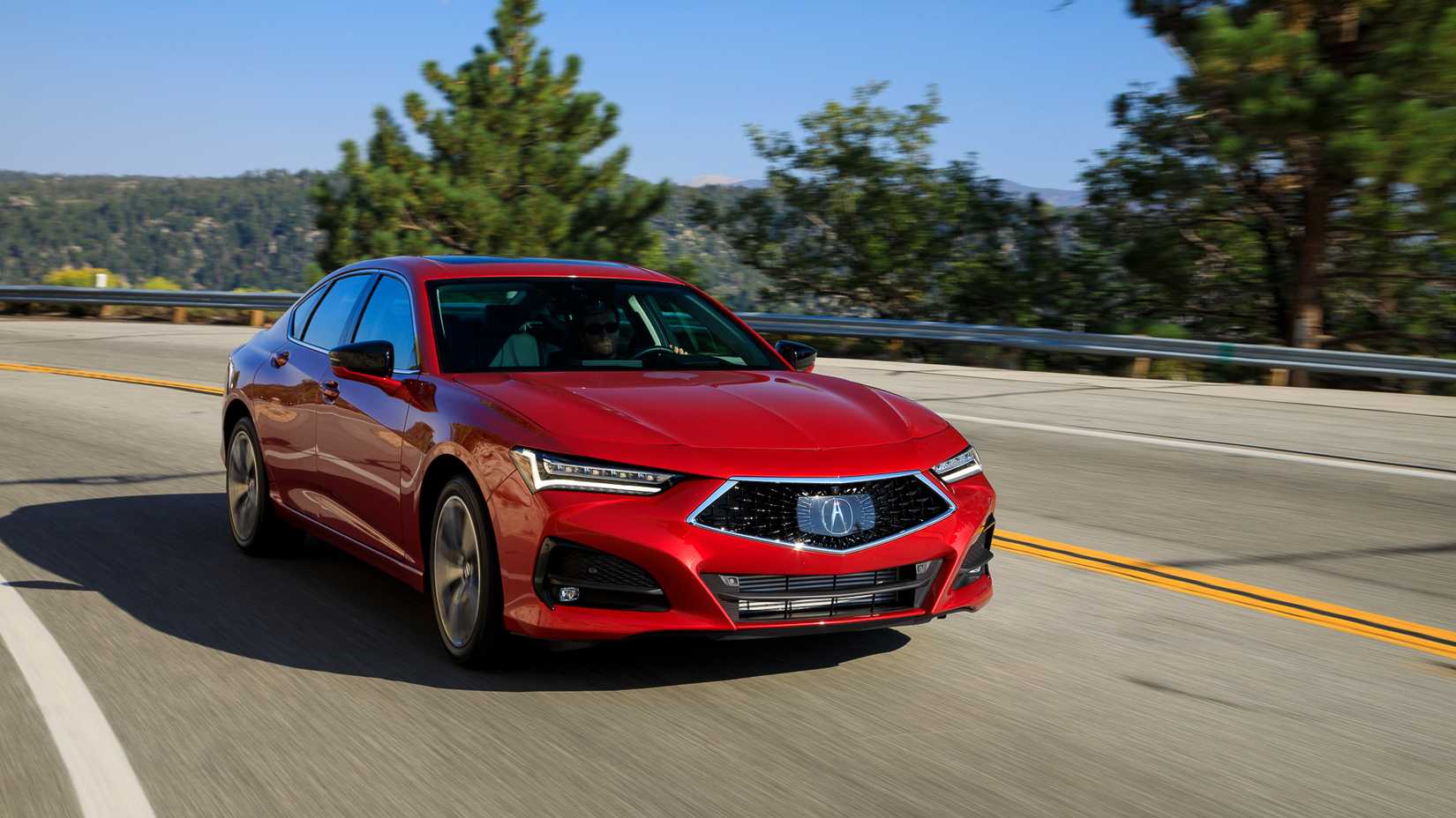 2021-2024 Red Acura TLX Driving on Road