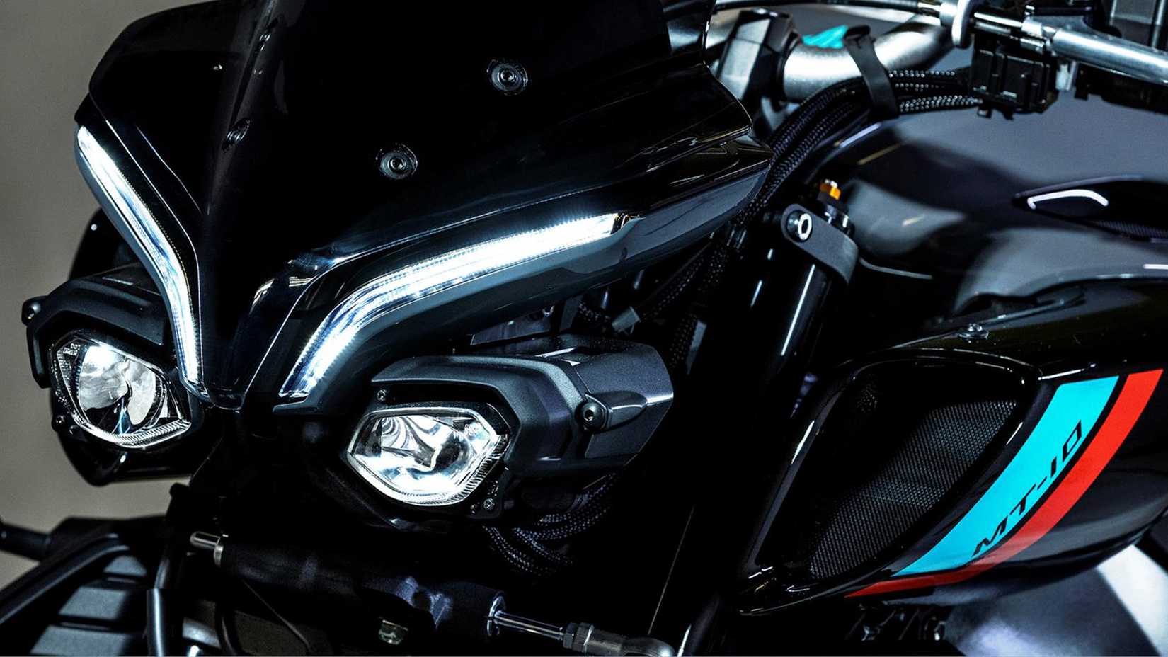 2023 YAMAHA MT-10 closeup detailed shot of front headlights and eyebrow lights.