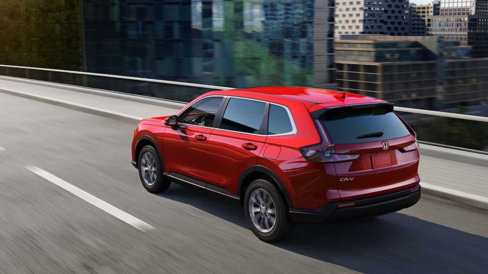 A rear shot of the 2024 Honda CR-V Hybrid in the city