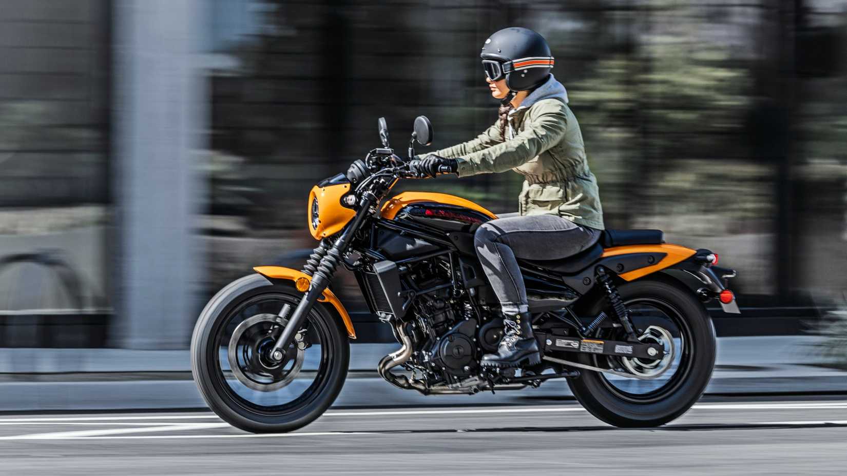 Orange 2024 Kawasaki Eliminator SE cruising on the road