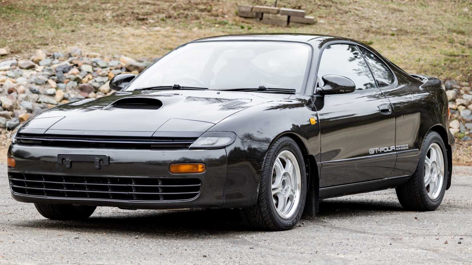 1990 Toyota Celica GT-Four in black Posing outside in front of hill
