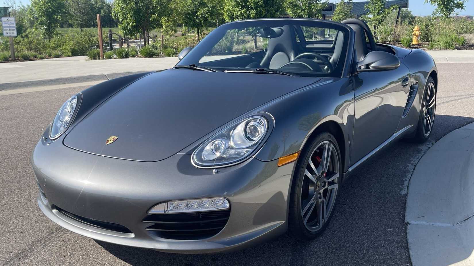 2012 Porsche Boxster in gray posing on suburban road