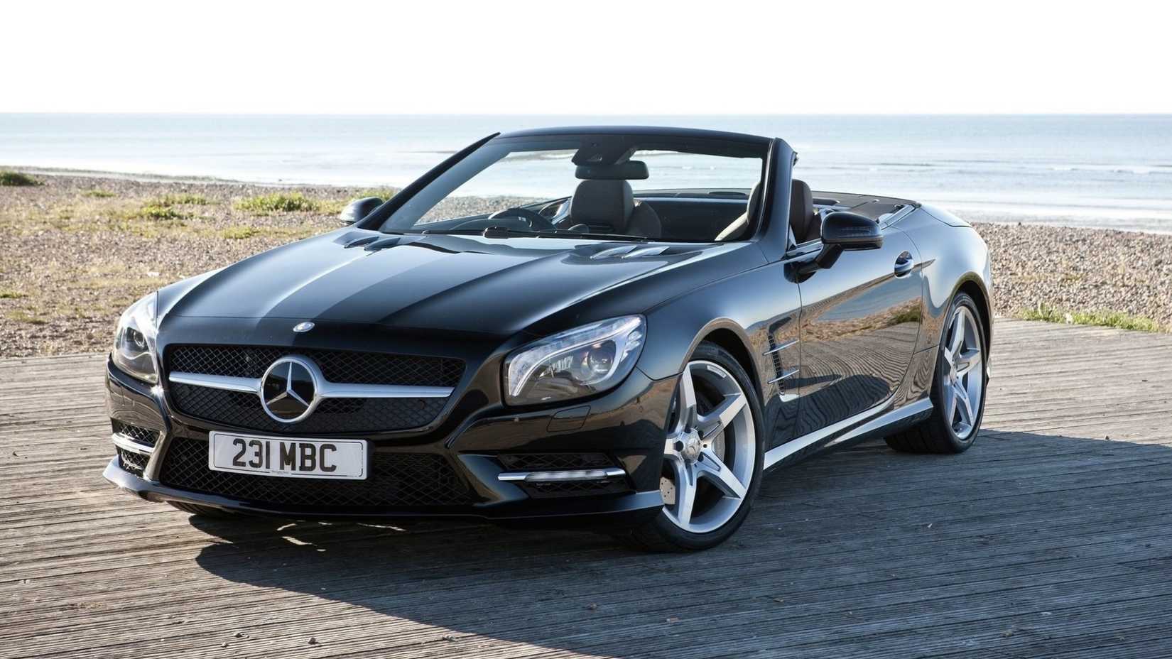 2013 Mercedes-Benz SL500 in black posing by ocean 