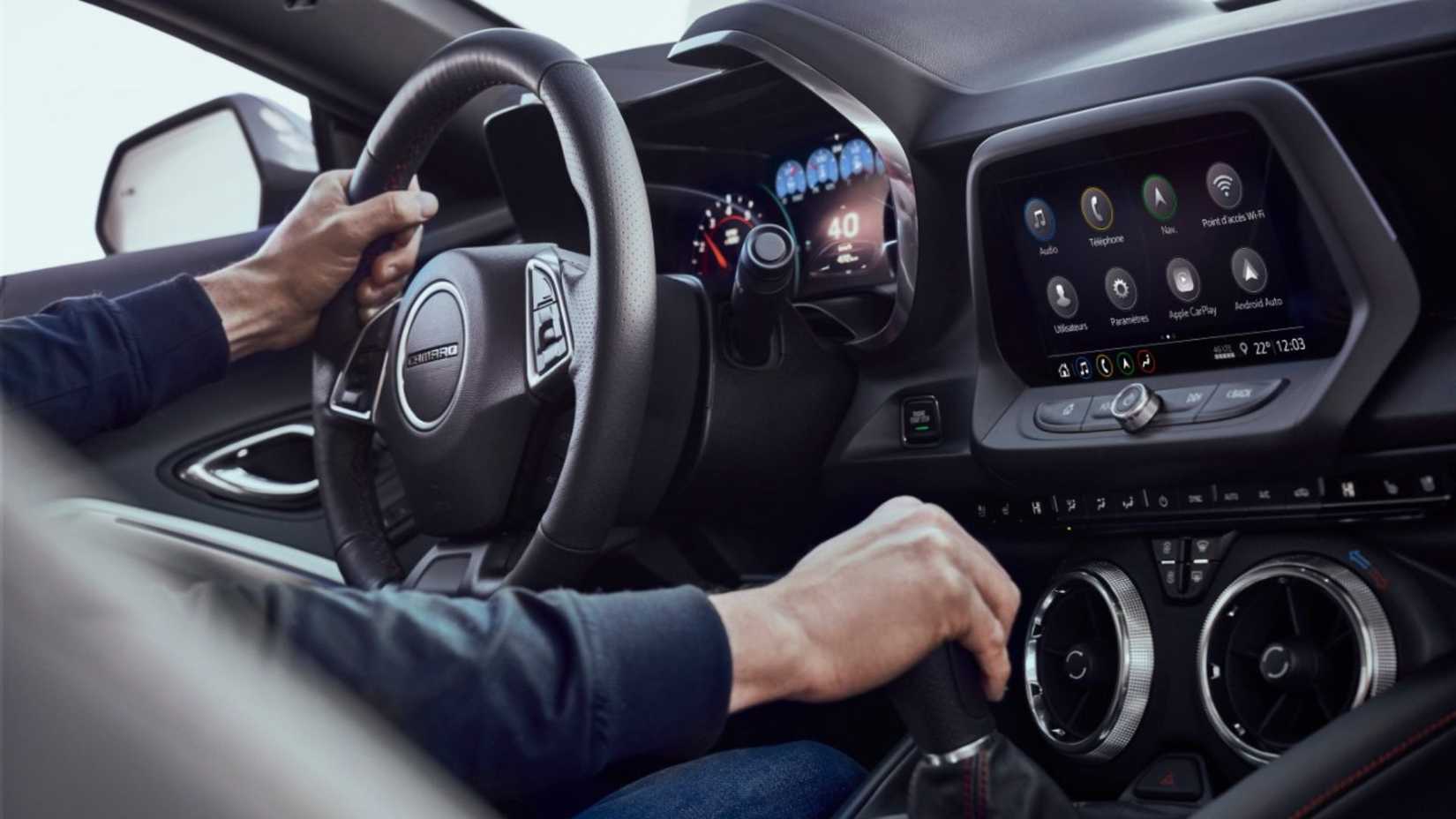 Interior view of 2023 Chevrolet Camaro SS dashboard and shifter.