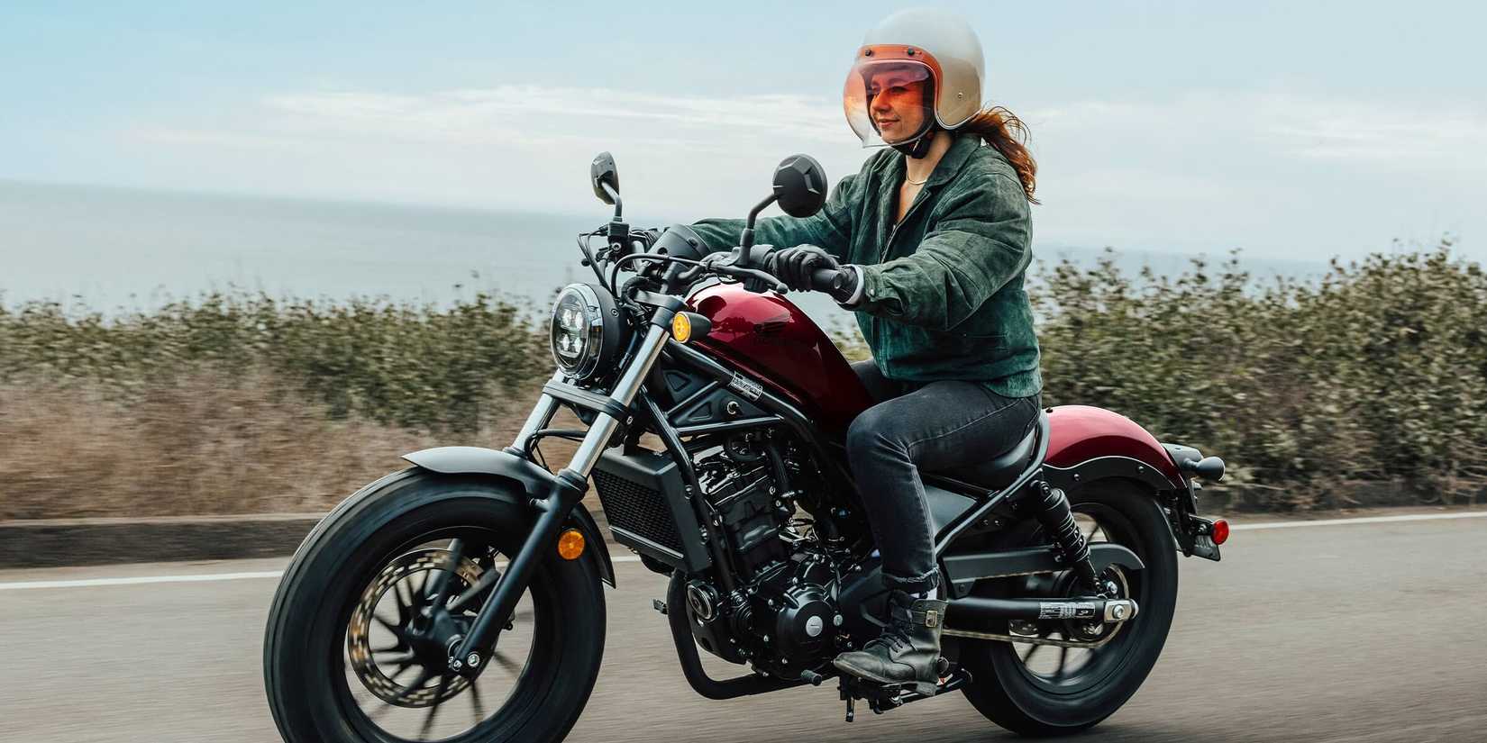Woman riding 2023 Honda Rebel 300 on highway