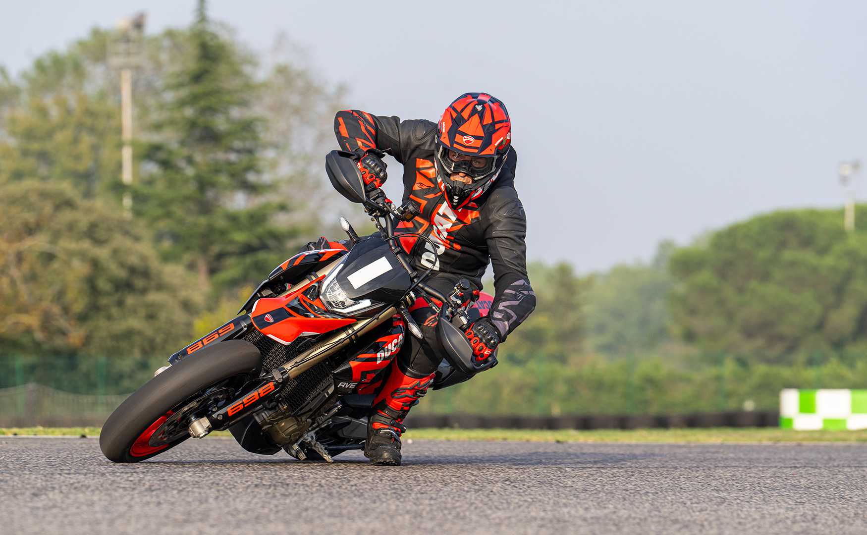 Action shot of the 2024 Ducati Hypermotard 698 RVE on track
