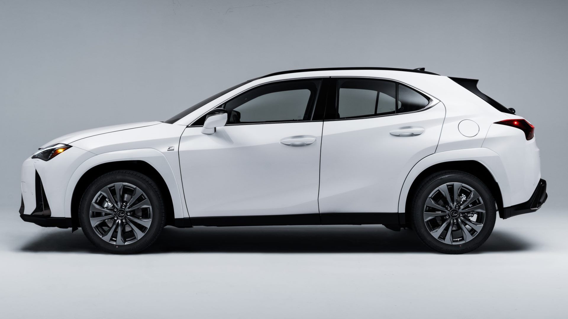 A left hand-side shot of a 2024 Lexus UX 250h F Sport