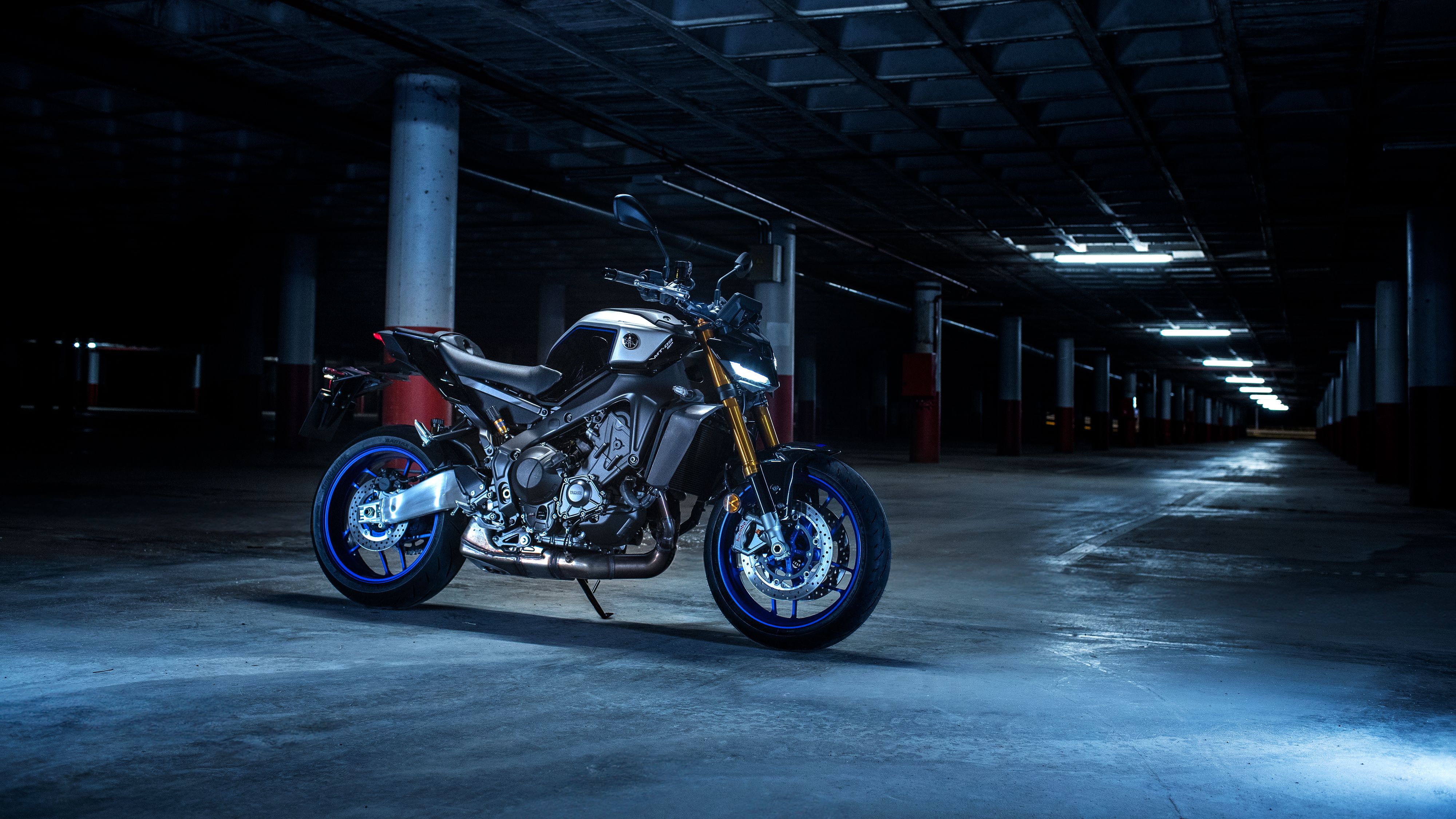 A dramatic shot of the 2024 Yamaha MT-09 SP parked in a garage