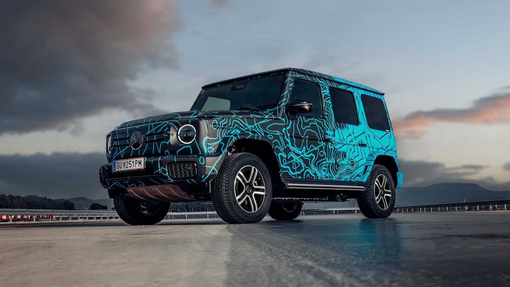 Front 3/4 view of a camouflaged Mercedes-Benz EQG prototype