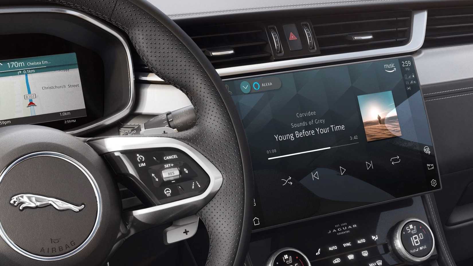 Close up of the steering wheel and infotainment screen in the 2023 Jaguar F-Pace