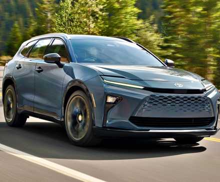 A front 3/4 action shot of a blue 2025 Toyota Crown Signia SUV