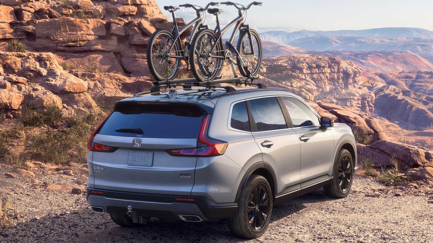 Silver 2023 Honda CR-V Sport Hybrid parked on a mountain