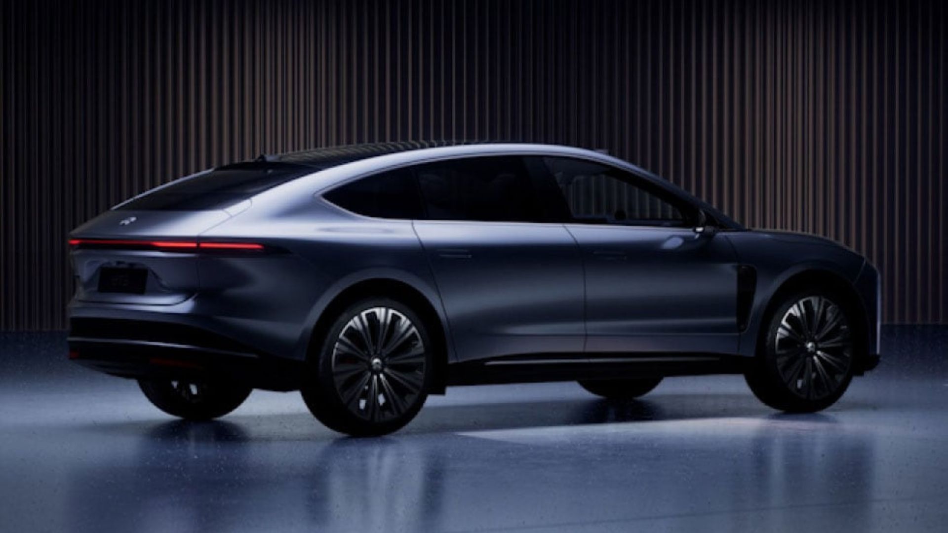 Rear profile — the concave tailgate is restrained, almost Scandinavian