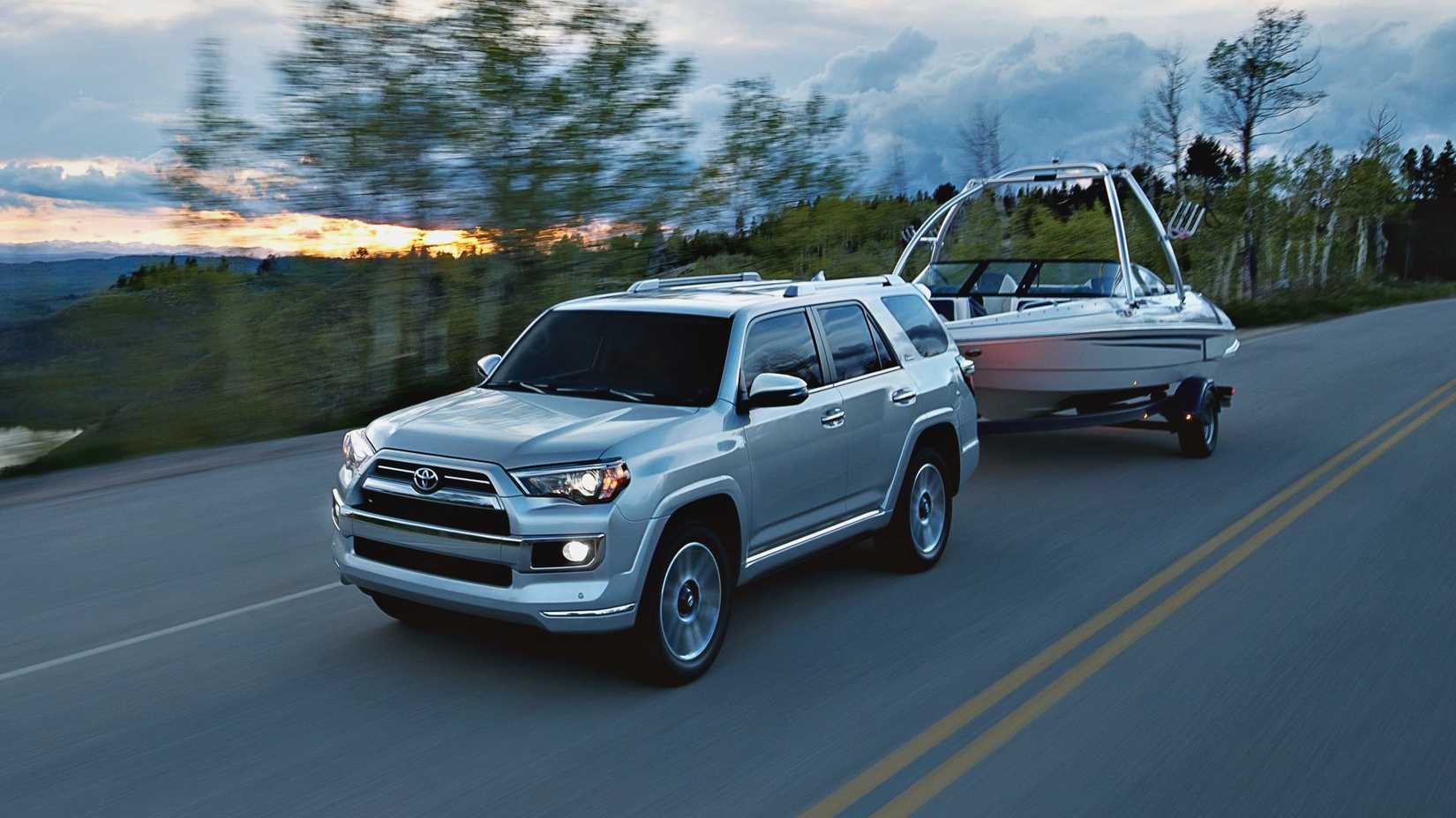 A front 3/4 action shot of a 2024 Toyota 4Runner Towing a boat