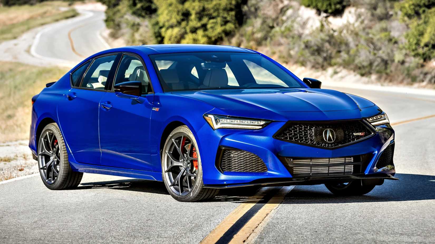 Blue 2021 Acura TLX Type S parked in the road