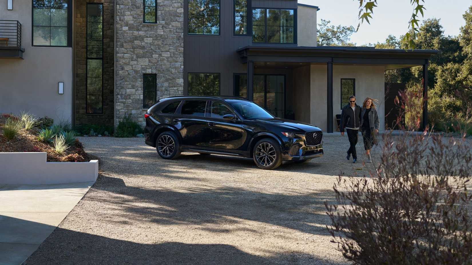 2025 Mazda CX-70 side shot parked in front of house