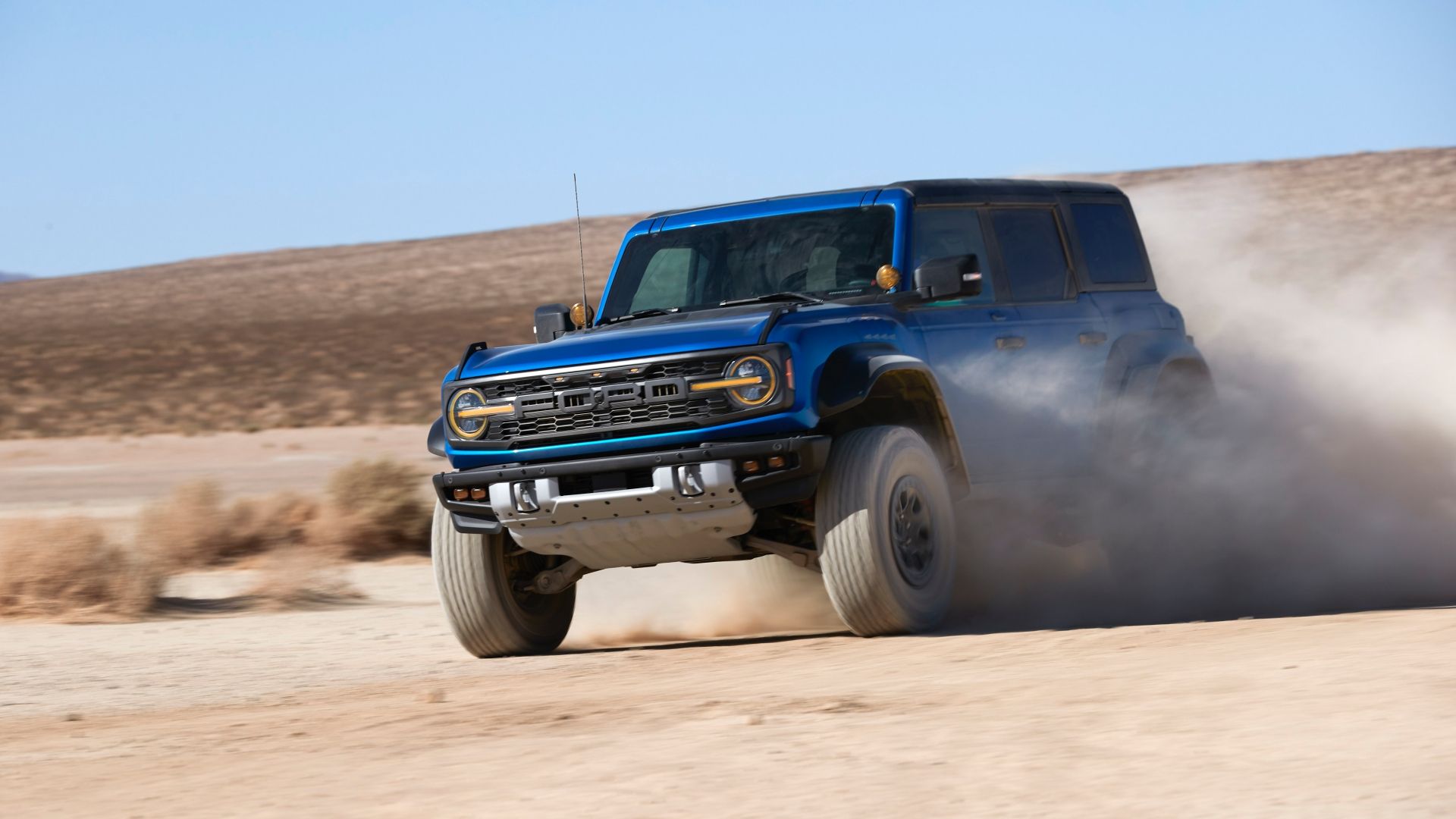 2022 Ford Bronco Raptor in blue driving in desert