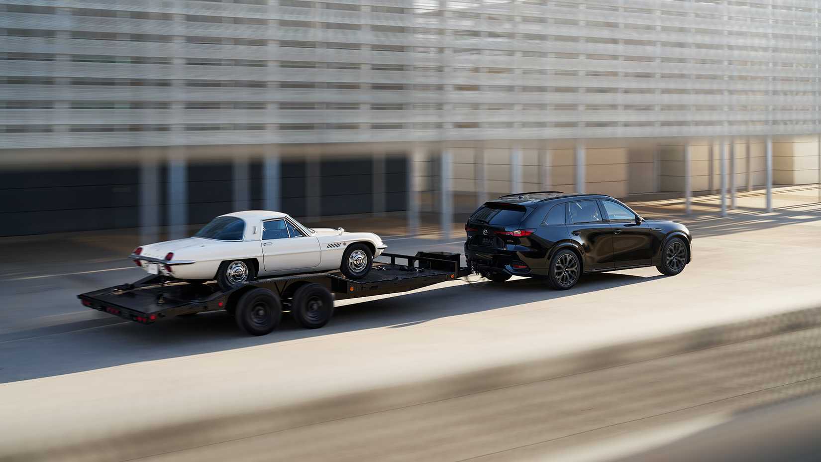 A 2025 Mazda CX-70 pulling a Cosmo on a trailer
