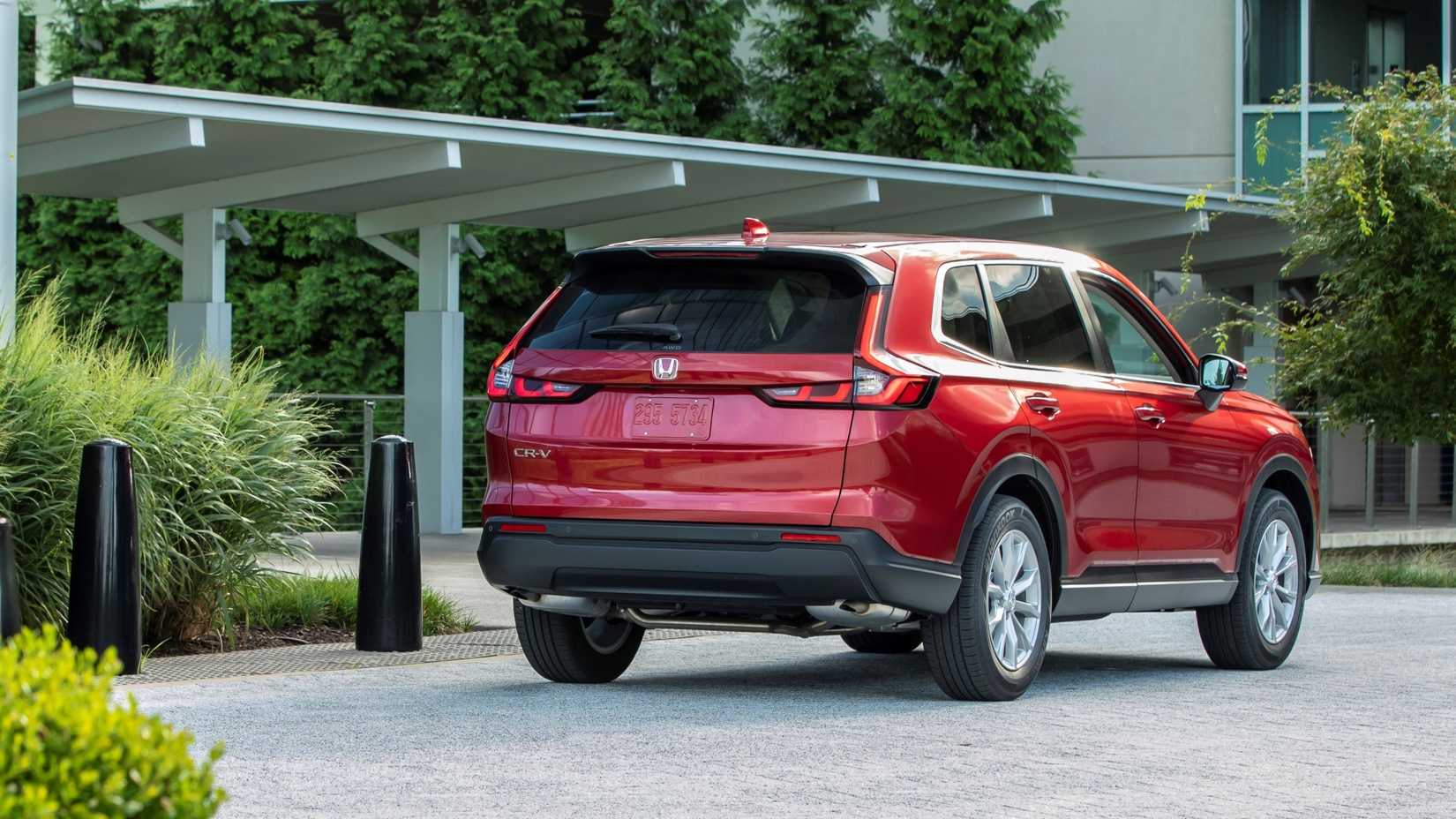 Rear 3/4 shot of a 2023 Honda CR-V parked in front of house