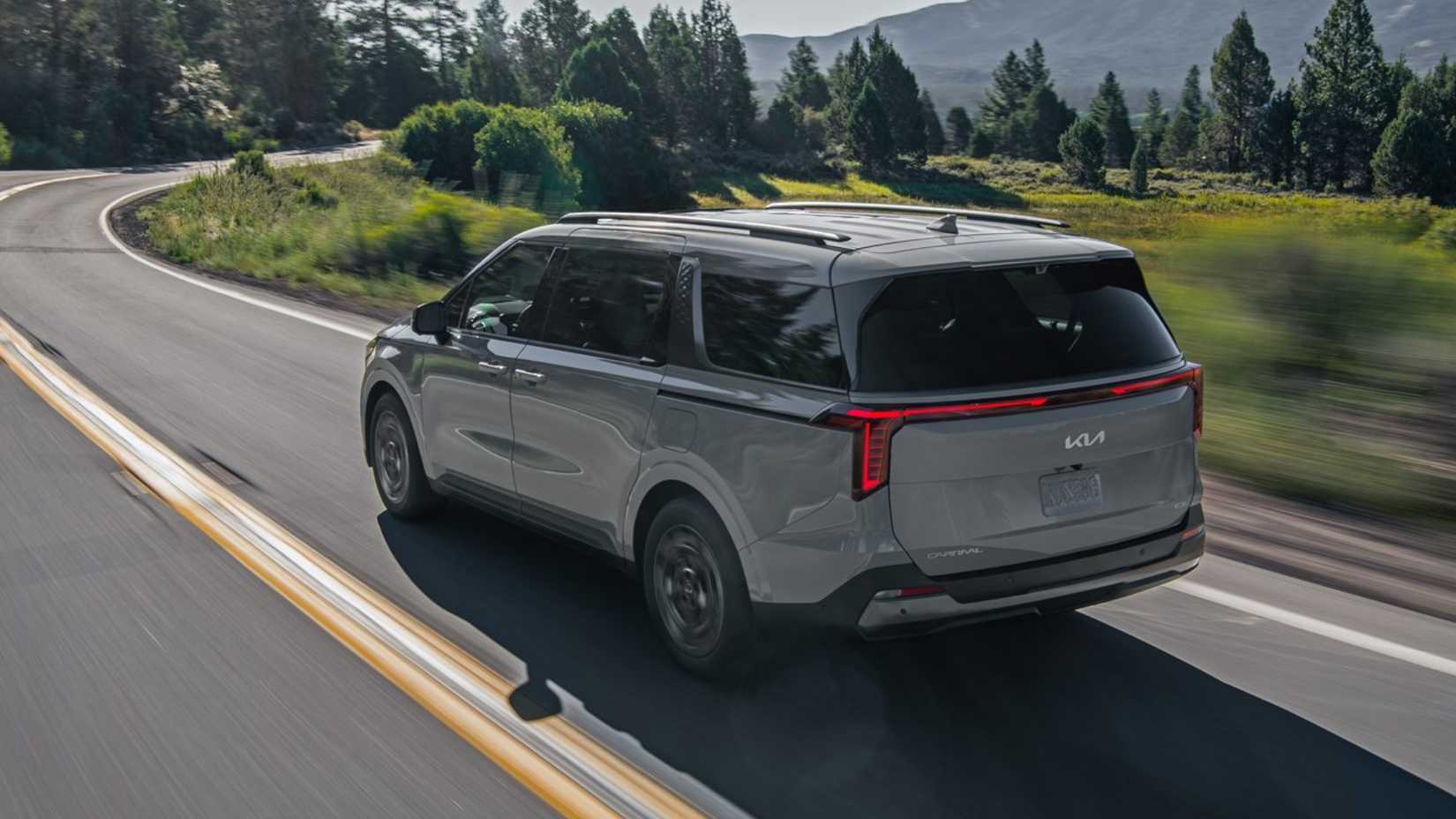 2025 Kia Carnival in gray being driven