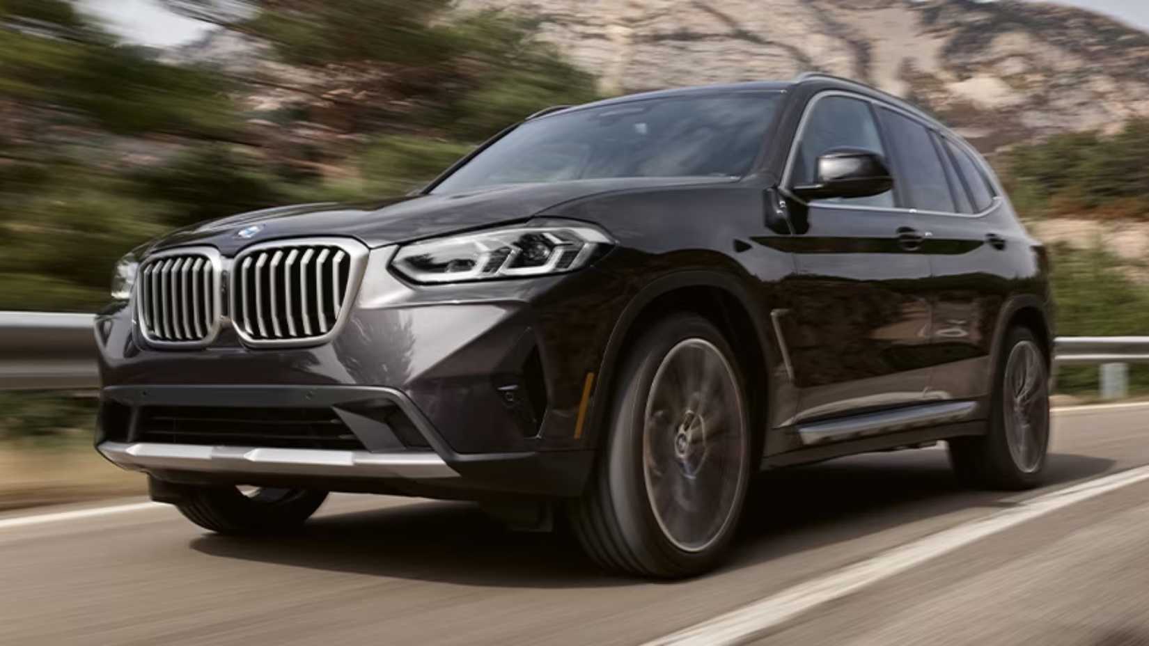 2023 BMW X3 in gray driving along road