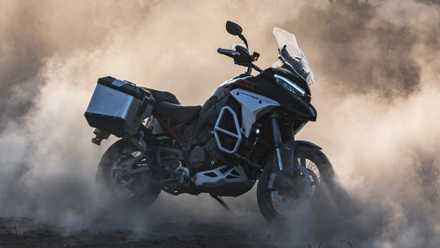 Ducati Multistrada V4 Rally stands with dust all around