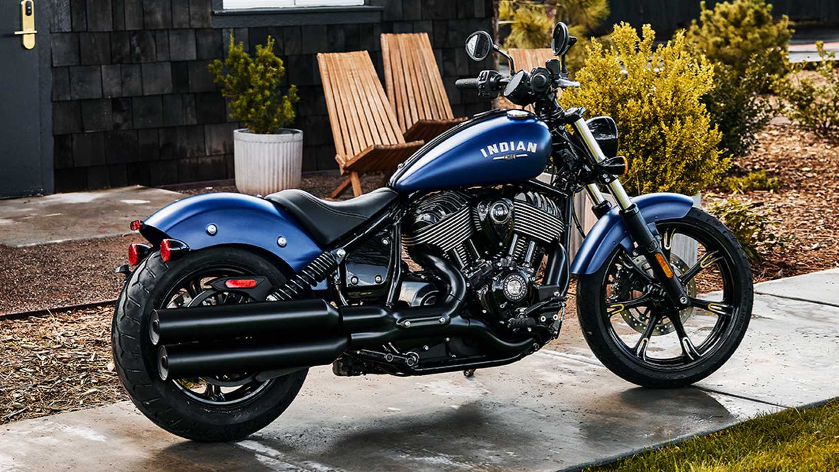 Blue Indian Chief Dark Horse parked on the sidewalk