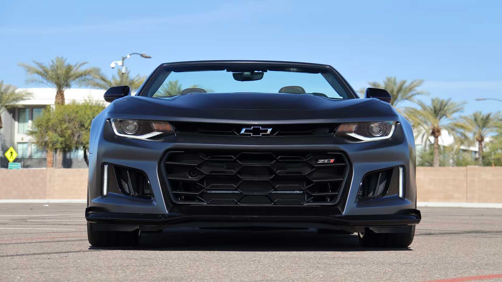Front 3/4 shot of a black 2024 Camaro ZL1 in parking lot