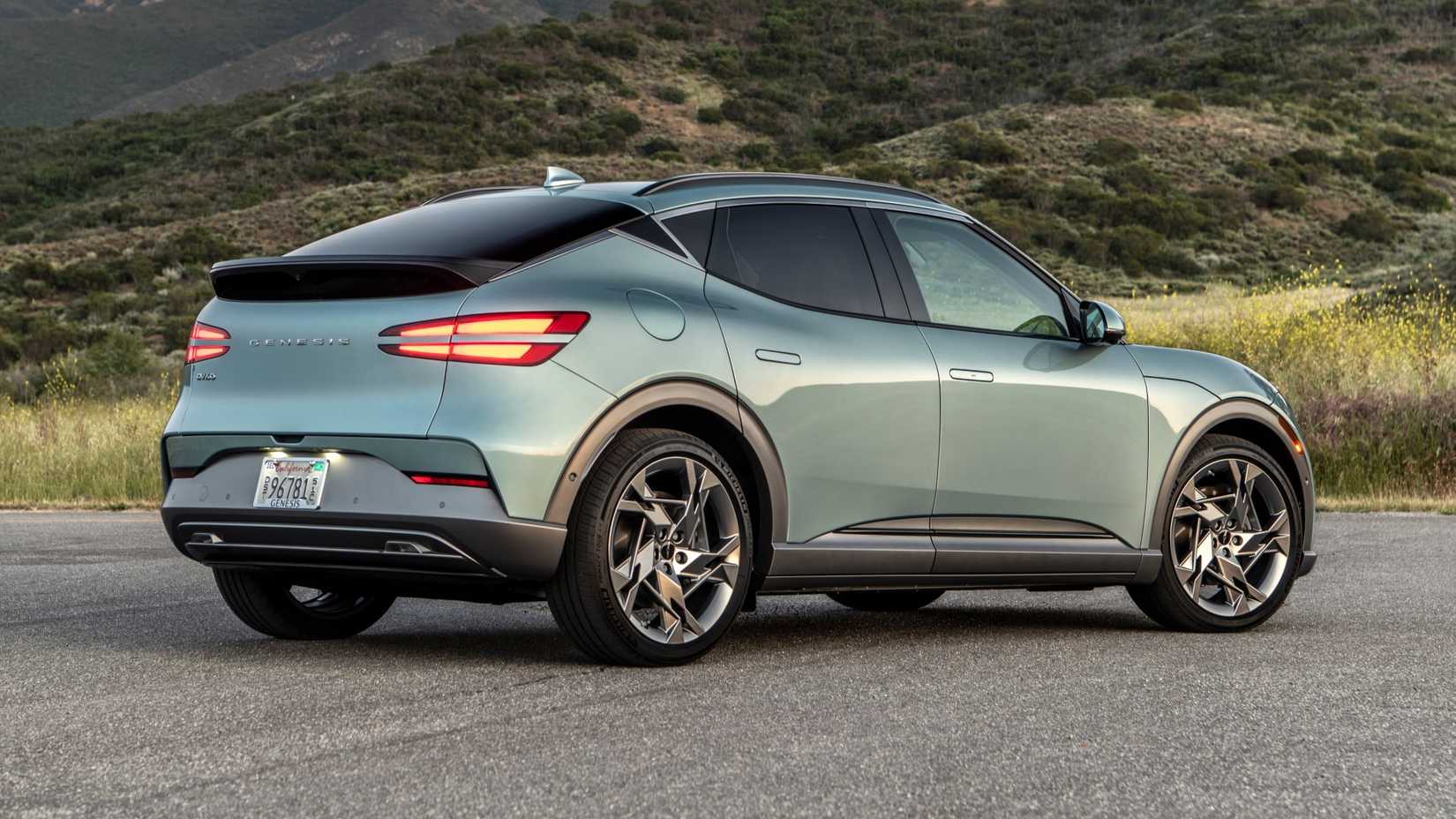 Blue 2024 Genesis GV60 rear-quarter