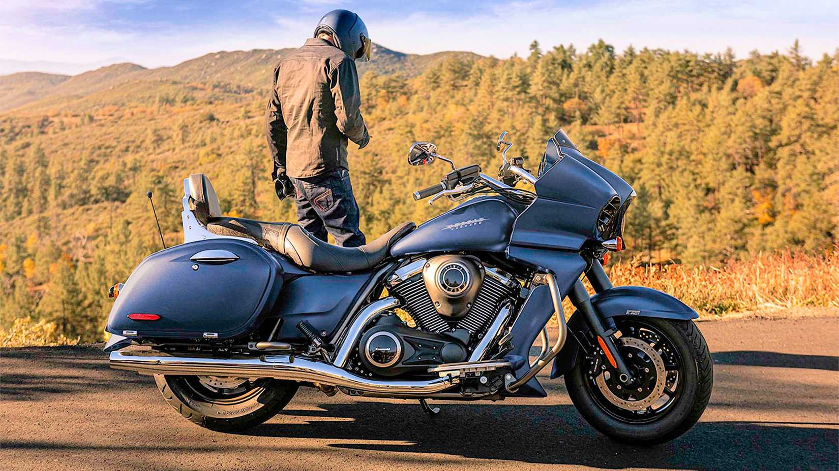 Rider standing next to a 2024 Kawasaki Vulcan 1700 Vaquero