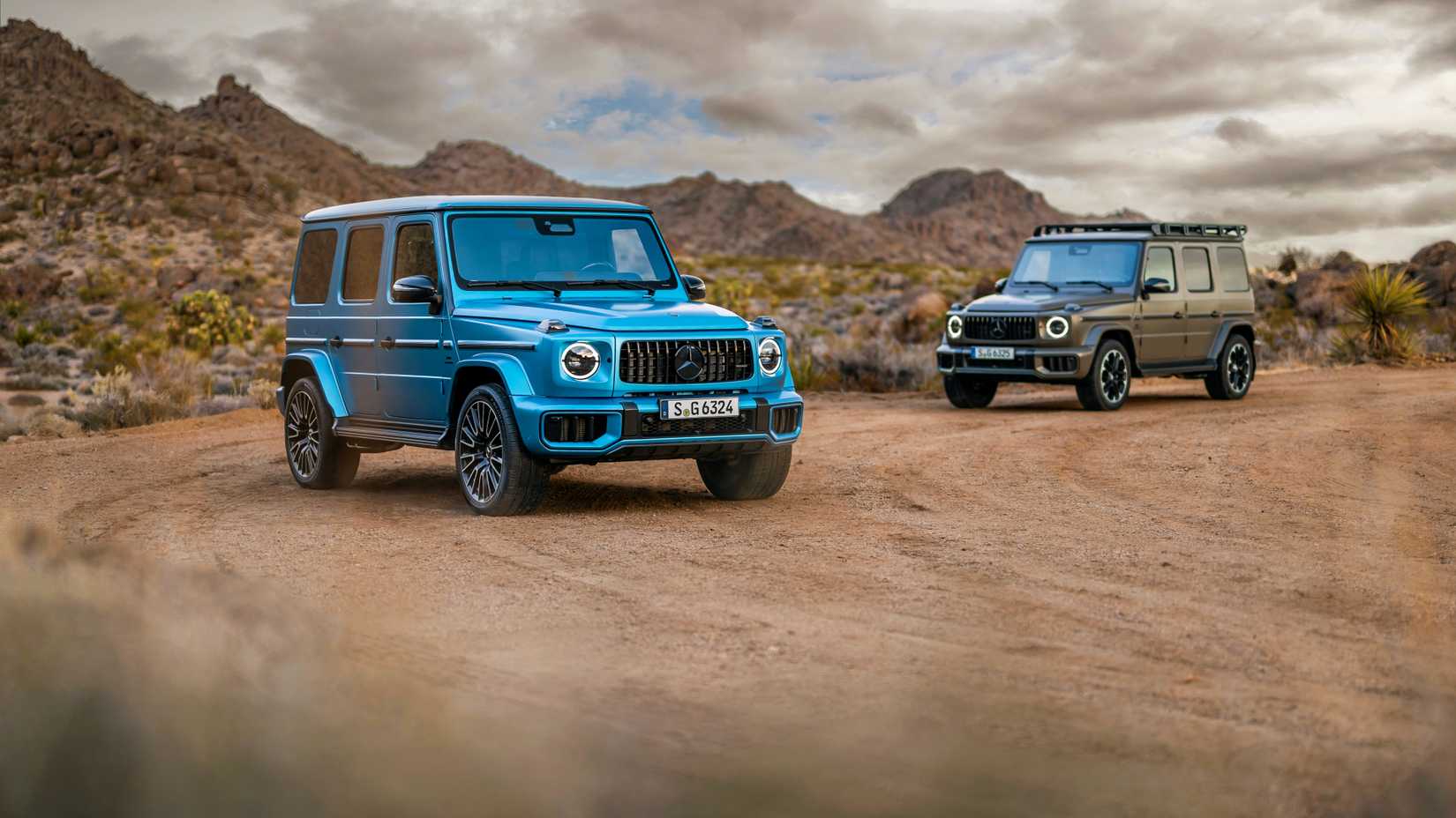 2025 Mercedes-Benz G-Class models side by side in the dirt