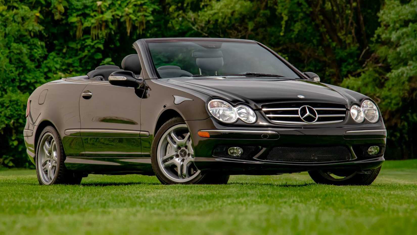 2005 Mercedes-Benz CLK 55 AMG In black With roof down posing in field