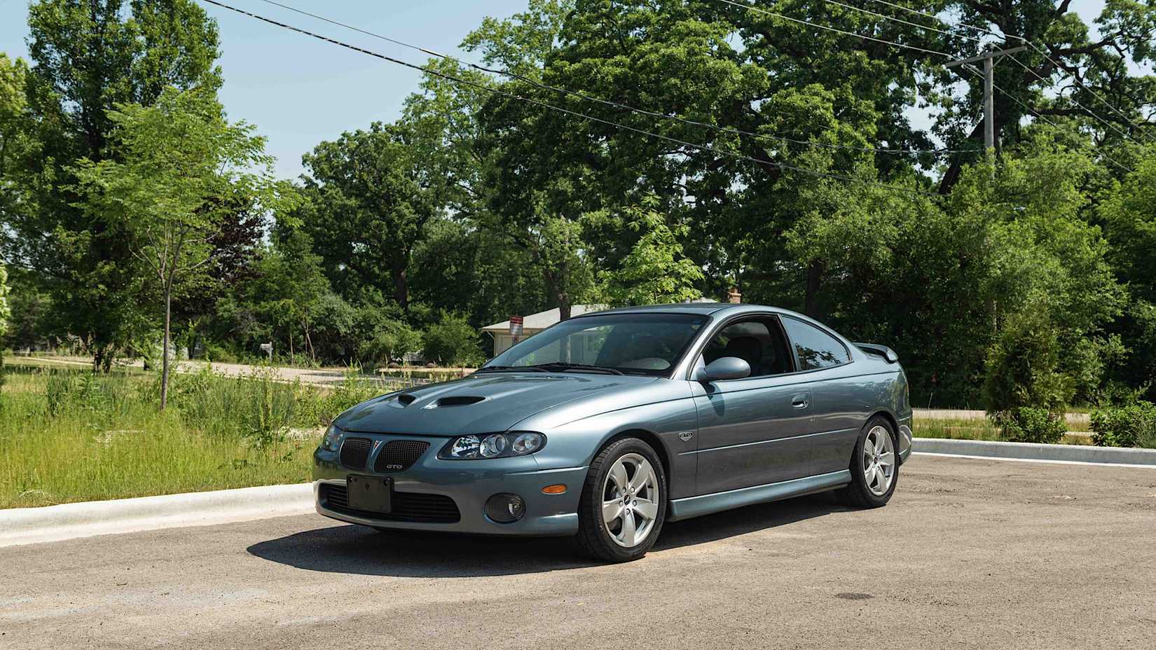 2006 Pontiac GTO In blue Posing in parking lot