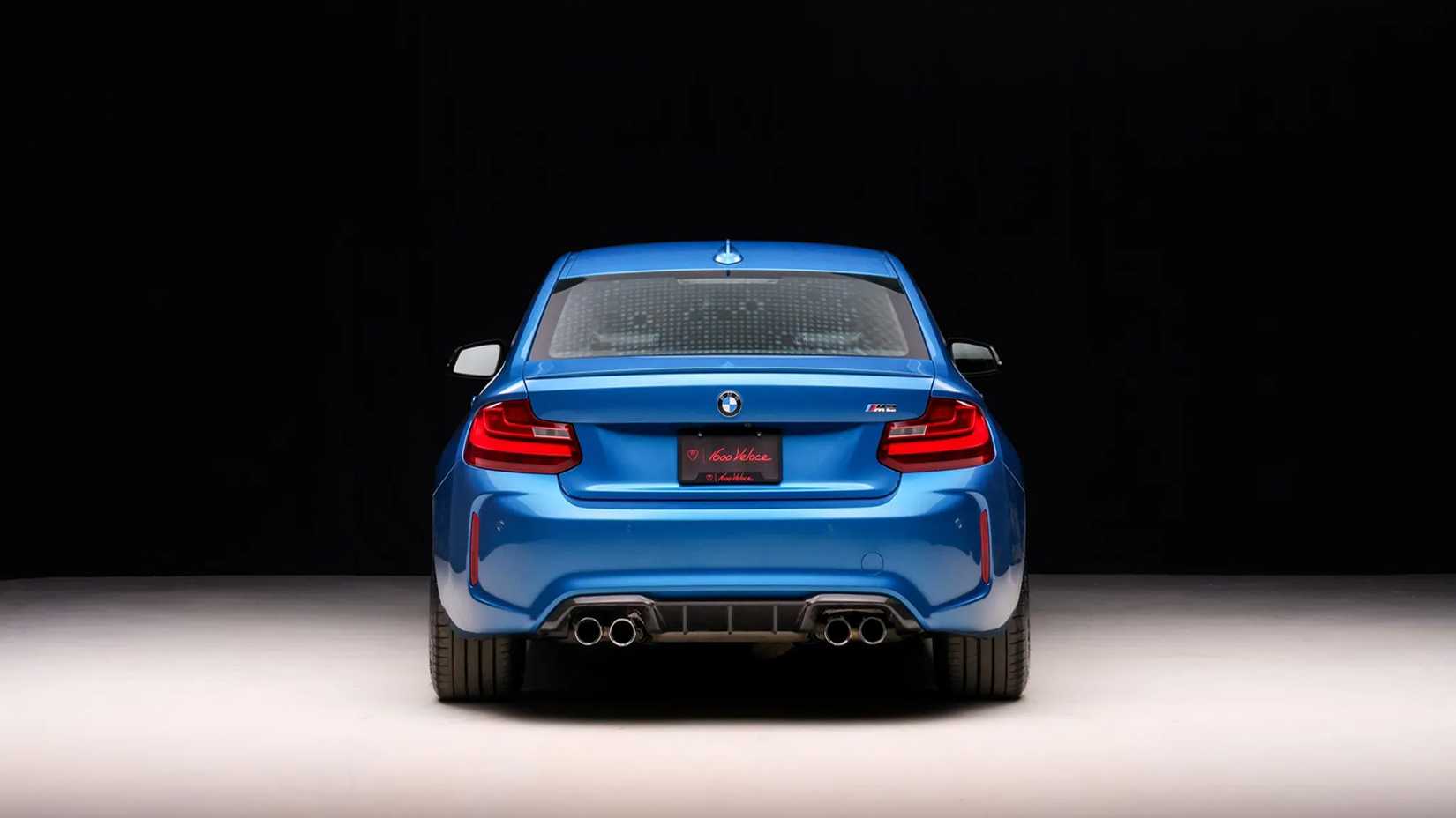 A rear view shot of a Blue 2016 BMW M2