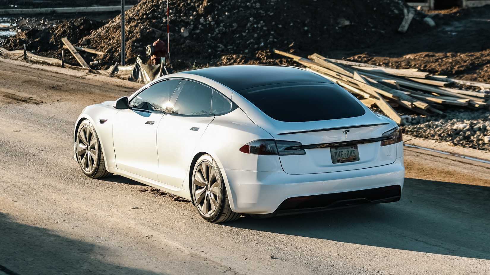 Rear three-quarters shot of a 2021 White Tesla Model S Plaid