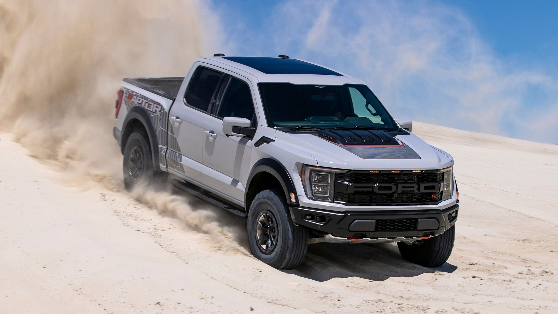 Avalanche Gray 2023 Ford F-150 Raptor R off-roading in the dunes