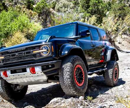 2024 Ford Bronco Raptor Code Orange front 3/4 shot rock crawling