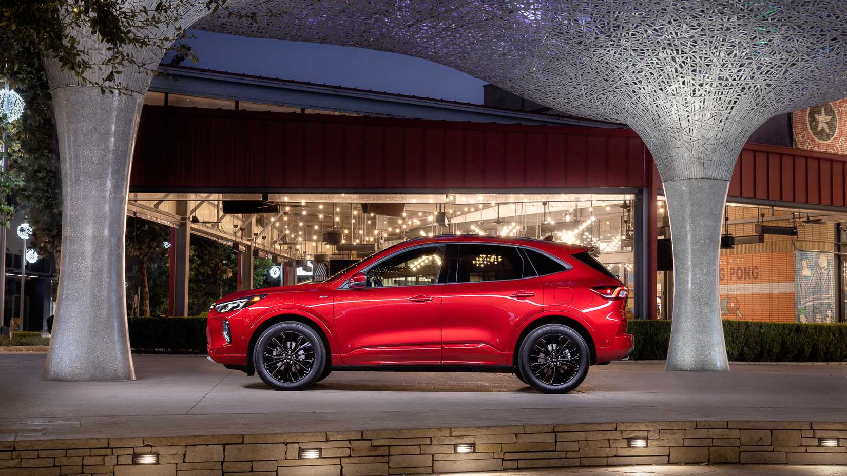 2024 Ford Escape side view parked in front of business