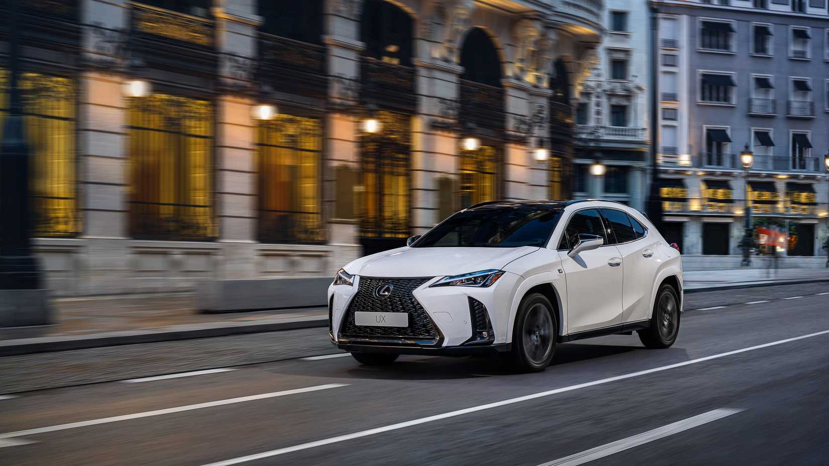 2025 Lexus UX 300h driving in an urban area