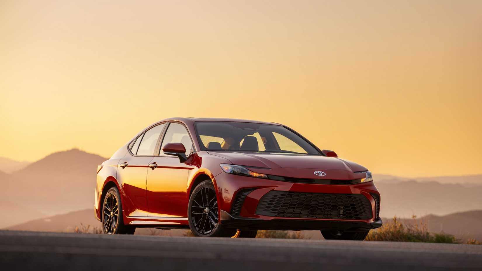 Front 3/4 shot of a red 2025 Toyota Camry AWD