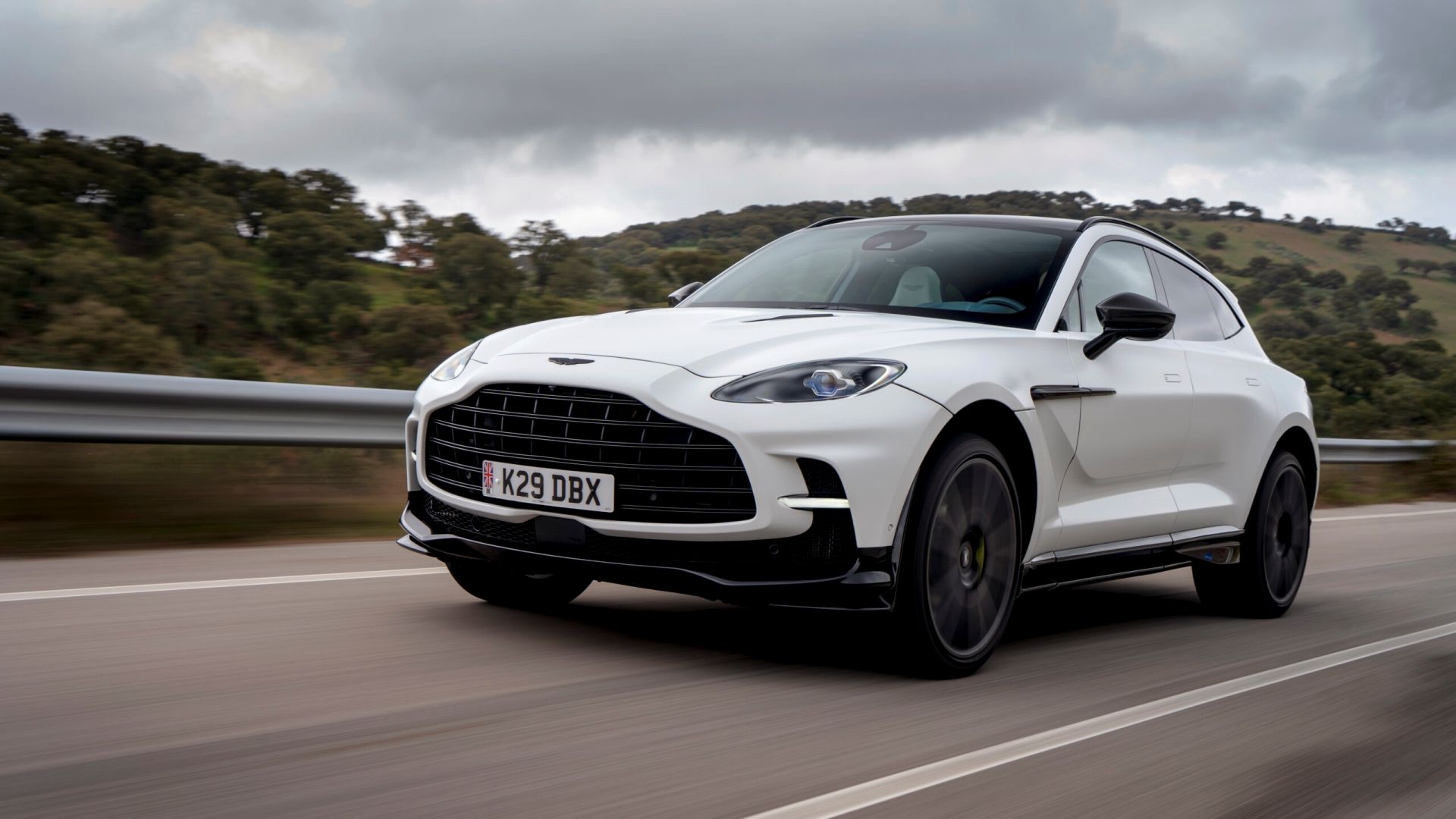 2024 Aston Martin DBX707 satin white front 3/4 shot driving