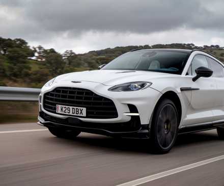 2024 Aston Martin DBX707 satin white front 3/4 shot driving
