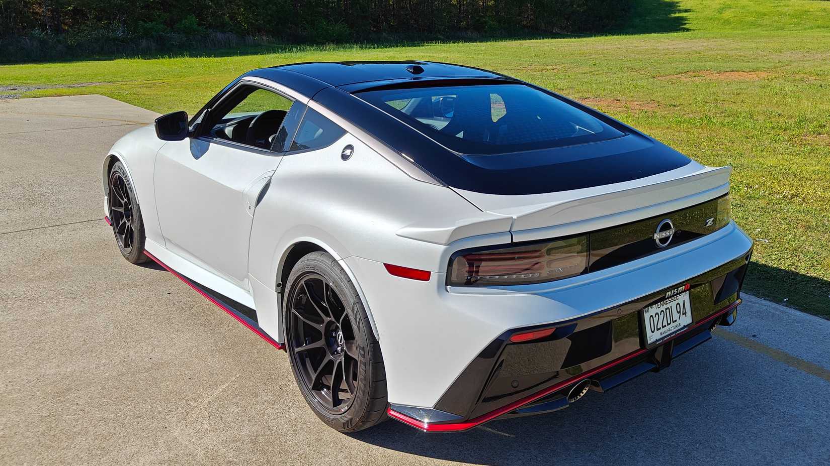 2024 White Nissan Z Nismo next to grass