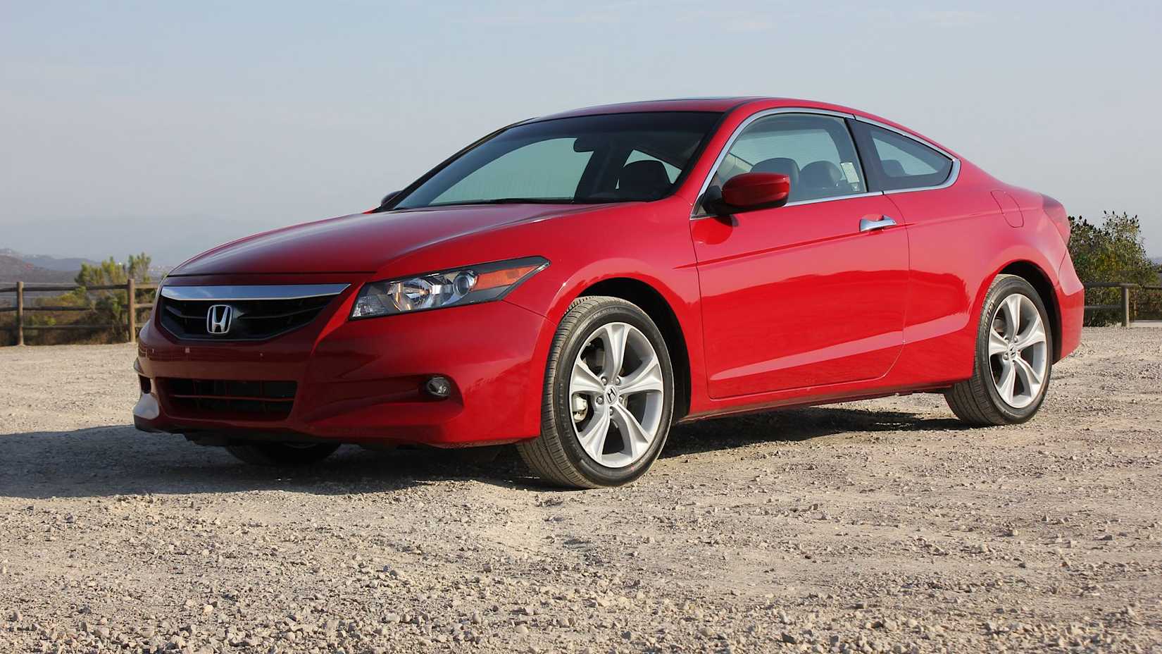 2011 Honda Accord in red posing on gravel road