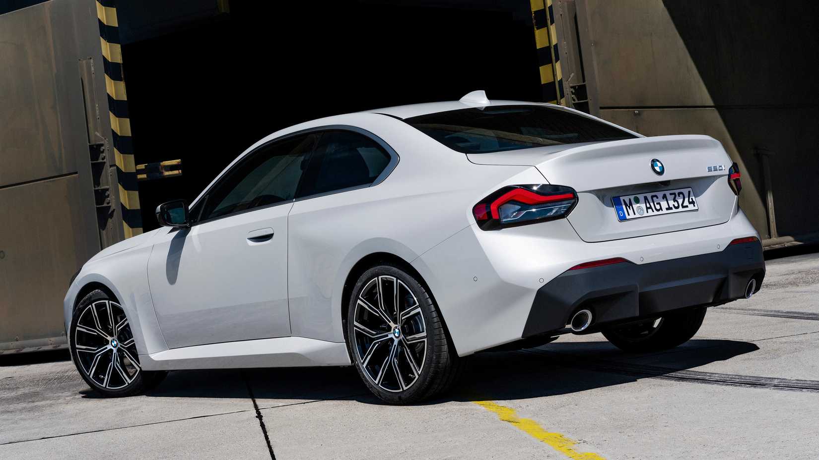 Mineral White Metallic 2022 BMW 2 Series Parked Rear 3/4 View