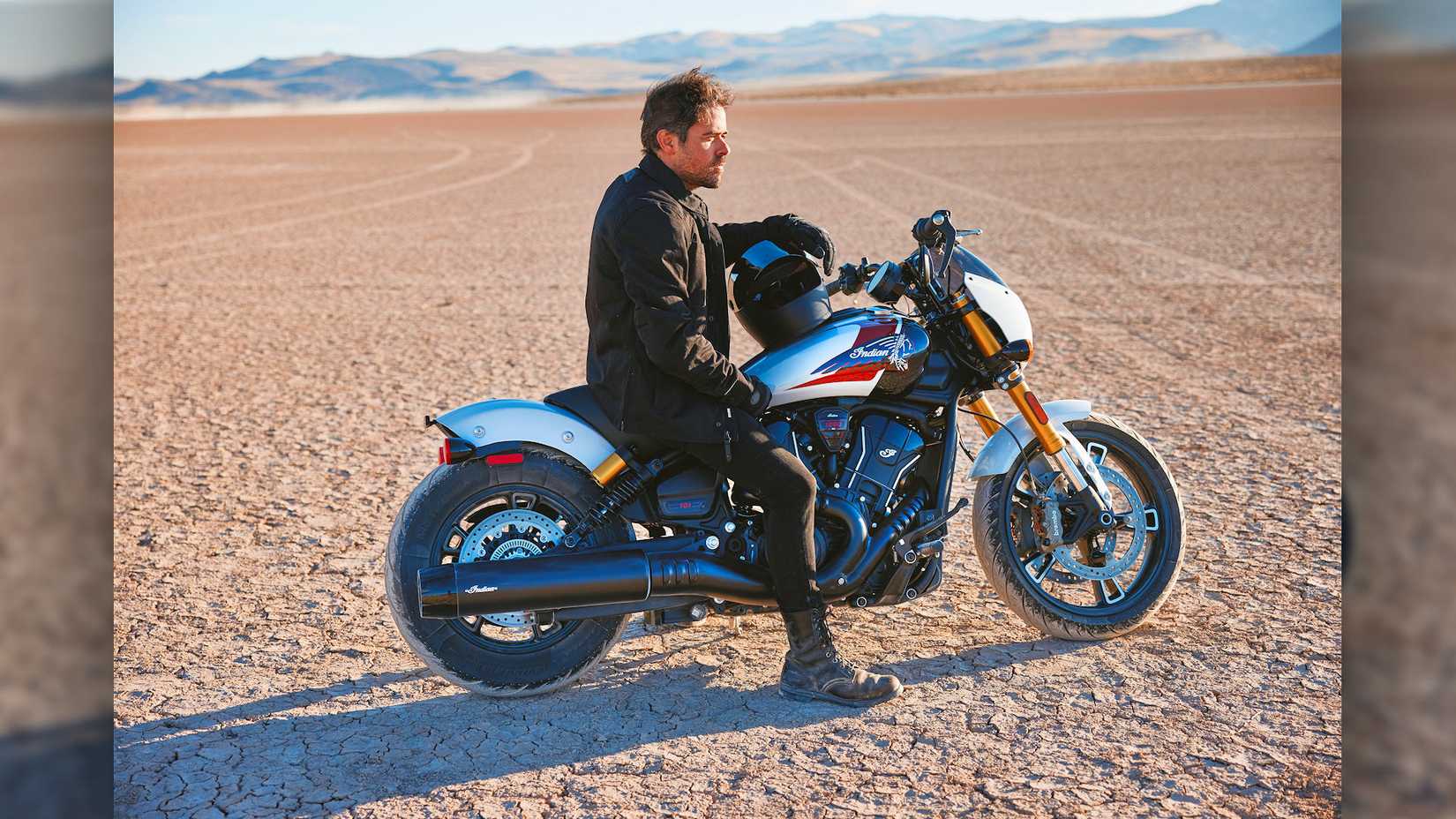 Rider sitting on a 2025 Indian 101 Scout in the desert