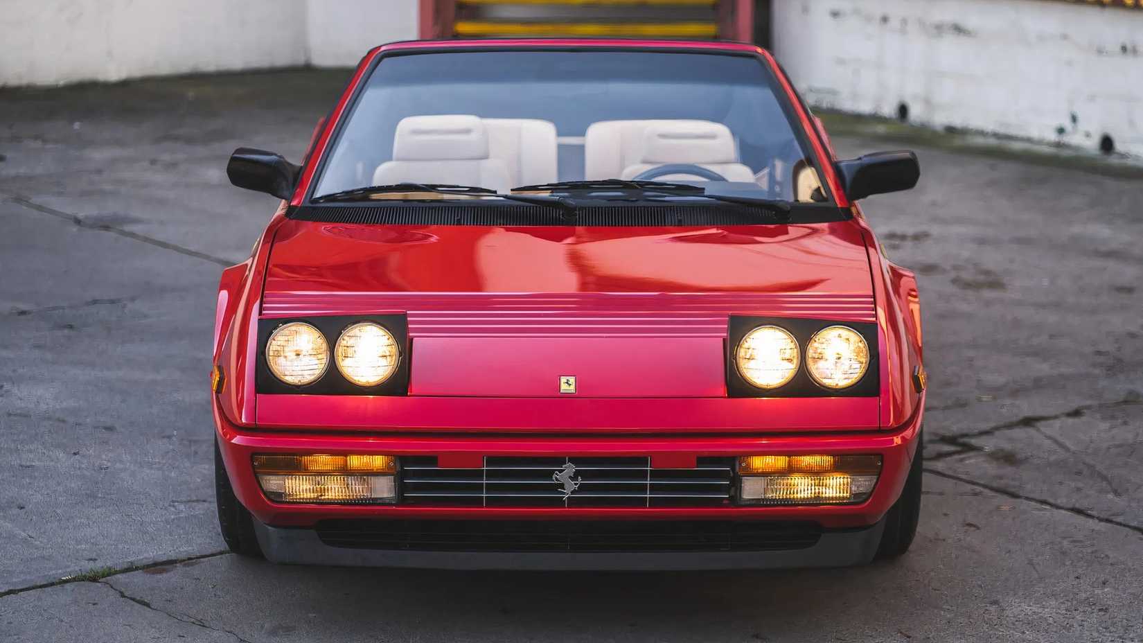 Close Up Of Red 1986 Ferrari Mondial 3.2 Cabriolet Front End Parked With Lights On