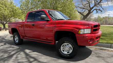 A red 1998 Dodge Ram 2500 Cummins front 3/4 exterior shot