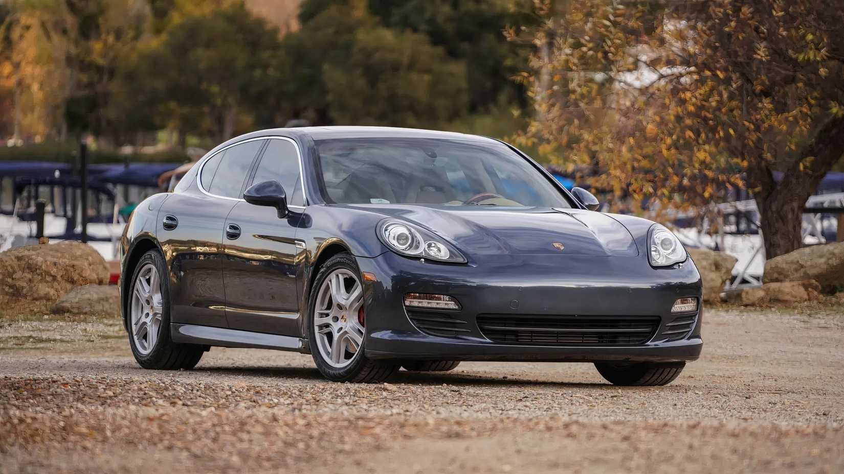 Blue Metallic 2011 Porsche Panamera S Parked On Gravel Road Font 3/4 View